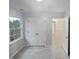 Bedroom featuring double closets and access to the upstairs hall at 1599 Rogers Pointe Ln, Creedmoor, NC 27522
