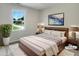 A cozy bedroom featuring stylish decor, a soft rug, and natural light from the window at 1599 Rogers Pointe Ln, Creedmoor, NC 27522