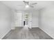 Bedroom with a window, ceiling fan, neutral carpet and doorway to bathroom at 1599 Rogers Pointe Ln, Creedmoor, NC 27522