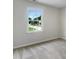 Clean and bright bedroom with a view of the outdoors from the window at 1599 Rogers Pointe Ln, Creedmoor, NC 27522