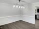 Bright dining room featuring a modern light fixture and neutral walls, perfect for entertaining at 1599 Rogers Pointe Ln, Creedmoor, NC 27522