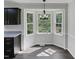 Open-concept kitchen and eating area with bay window and modern light fixture at 1599 Rogers Pointe Ln, Creedmoor, NC 27522