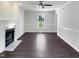 Bright living room with a cozy fireplace, fresh paint, and modern ceiling fan at 1599 Rogers Pointe Ln, Creedmoor, NC 27522