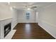 Bright living room with fireplace, ceiling fan and hardwood floors at 1599 Rogers Pointe Ln, Creedmoor, NC 27522