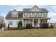 Charming two-story home with gray siding, shuttered windows, and a welcoming front porch at 177 Clarence Ln, Garner, NC 27529