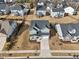 Aerial view of a well-maintained two-story home with a landscaped front yard in a residential neighborhood at 1829 Knights Crest Way, Wake Forest, NC 27587