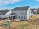 View of the backyard with a screened porch, a playset and fencing at 1829 Knights Crest Way, Wake Forest, NC 27587