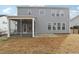 Wide view of the backyard showing the screened porch, exterior, and lawn at 1829 Knights Crest Way, Wake Forest, NC 27587