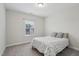 Cozy bedroom with a comfortable bed, a window providing natural light, and soft carpet at 1829 Knights Crest Way, Wake Forest, NC 27587