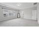 Spacious bedroom with tray ceiling, a large window offering natural light, and neutral carpet at 1829 Knights Crest Way, Wake Forest, NC 27587
