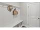 Cozy entryway featuring a built-in bench with storage, coat hooks, and stylish decor at 1829 Knights Crest Way, Wake Forest, NC 27587