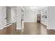 Spacious living room with hardwood floors, white trim, tray ceiling, and lots of natural light at 1829 Knights Crest Way, Wake Forest, NC 27587