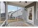 Screened porch with outdoor rug, ceiling fan and view of the backyard at 1829 Knights Crest Way, Wake Forest, NC 27587