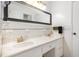 Bathroom with double sink vanity, marble countertop, and tiled wall at 2005 Sutphin Dr, Sanford, NC 27330