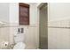 Bathroom featuring a toilet and shower with white tiled walls and floors at 2005 Sutphin Dr, Sanford, NC 27330