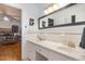 Clean bathroom features a double sink vanity, a large mirror, and access to the main bedroom at 2005 Sutphin Dr, Sanford, NC 27330