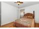 Serene bedroom with hardwood floors is enhanced by ample natural light and a ceiling fan at 2005 Sutphin Dr, Sanford, NC 27330