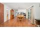 Bright dining area with hardwood floors, sliding glass doors, and a view of the modern kitchen at 2005 Sutphin Dr, Sanford, NC 27330