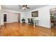 Bright dining area features gleaming hardwood floors and a ceiling fan at 2005 Sutphin Dr, Sanford, NC 27330
