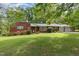 Charming single-story brick home featuring an attached two-car garage and a well-maintained front lawn at 2005 Sutphin Dr, Sanford, NC 27330