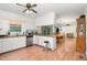 Well-lit kitchen showcasing white cabinets, stainless steel appliances, and an open design concept at 2005 Sutphin Dr, Sanford, NC 27330