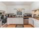 Functional kitchen featuring stainless steel appliances, ample counter space, and bright lighting at 2005 Sutphin Dr, Sanford, NC 27330