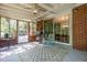 Outdoor patio with brick accents, furniture, and view to the surrounding nature at 2005 Sutphin Dr, Sanford, NC 27330