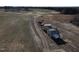 Aerial view of a large lot, featuring some structures that could be renovated or provide an opportunity to start fresh at 2113 Nc 55, Coats, NC 27521