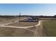 Expansive aerial shot of the property with a long driveway and ample space at 2113 Nc 55, Coats, NC 27521