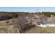 Scenic aerial view of a sprawling property showcasing multiple homes and lush greenery at 2113 Nc 55, Coats, NC 27521