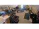 Spacious bonus room with a large window, gym equipment, desk, shelves, and TV at 2113 Nc 55, Coats, NC 27521