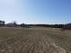 Picturesque land featuring a farmhouse and sprawling fields, offering a serene lifestyle at 2113 Nc 55, Coats, NC 27521