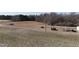 Spacious land with utility poles and potential for development, including rustic outbuildings at 2113 Nc 55, Coats, NC 27521