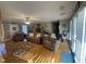 Cozy living room featuring hardwood floors, natural light, comfortable seating, and a ceiling fan at 2113 Nc 55, Coats, NC 27521