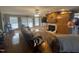 This living room features hardwood floors, a fireplace, built-in shelves, and large windows at 2113 Nc 55, Coats, NC 27521