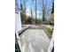 Backyard with a concrete patio and view of a treed lot at 2114 Stoney Spring Dr, Raleigh, NC 27610