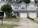 Charming townhome featuring a one car garage, complemented by tasteful landscaping and curb appeal at 2114 Stoney Spring Dr, Raleigh, NC 27610