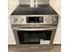 Close up of stainless steel electric stove with glass top and digital display panel at 2114 Stoney Spring Dr, Raleigh, NC 27610