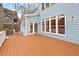 Large rear deck provides access to the sunroom and offers ample space for outdoor gatherings at 216 Copper Beech Ct, Chapel Hill, NC 27517