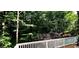 Beautiful landscaped backyard with privacy fencing and a natural tree line at 216 Copper Beech Ct, Chapel Hill, NC 27517