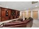 Finished basement with comfortable seating, custom built-ins, and access to the outdoors at 216 Copper Beech Ct, Chapel Hill, NC 27517