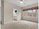 Bright bedroom with neutral carpet, a ceiling fan, and view of bathroom at 216 Copper Beech Ct, Chapel Hill, NC 27517