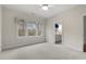 Bedroom features three windows offering natural light and ensuite bathroom entrance at 216 Copper Beech Ct, Chapel Hill, NC 27517