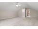 Large bonus room with neutral carpet, ceiling fan, doorway to walk-in closet at 216 Copper Beech Ct, Chapel Hill, NC 27517