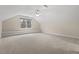 Spacious carpeted bonus room featuring a window seat and neutral walls at 216 Copper Beech Ct, Chapel Hill, NC 27517