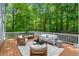 Large deck providing scenic wooded views and outdoor seating at 216 Copper Beech Ct, Chapel Hill, NC 27517