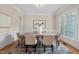 Dining room featuring a dining table with six chairs, neutral decor, and natural light at 216 Copper Beech Ct, Chapel Hill, NC 27517
