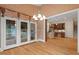 The dining area flows seamlessly into the kitchen and features doors out to a covered deck at 216 Copper Beech Ct, Chapel Hill, NC 27517