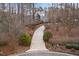 A long driveway leads to this home that is surrounded by beautiful landscaping at 216 Copper Beech Ct, Chapel Hill, NC 27517