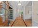 Bright foyer featuring hardwood floors with decorative inlay and views into other rooms of the home at 216 Copper Beech Ct, Chapel Hill, NC 27517